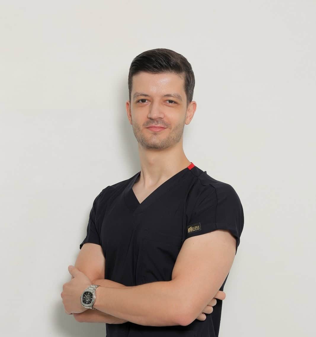 Portrait of Dr. Andi Gjata, professional dentist at the dental clinic.